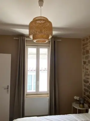 Un ou plusieurs lits dans un hébergement de l'établissement Hilo Charming Appartment Saint Laurent Sur Sane