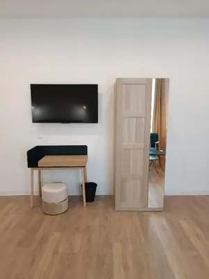 Télévision ou salle de divertissement dans l'établissement Clos de la Providence Chambres d'hôtes, piscine et Spa
