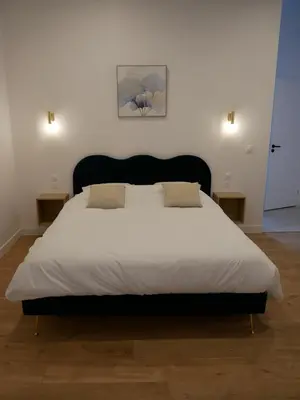 Un ou plusieurs lits dans un hébergement de l'établissement Clos de la Providence Chambres d'hôtes, piscine et Spa