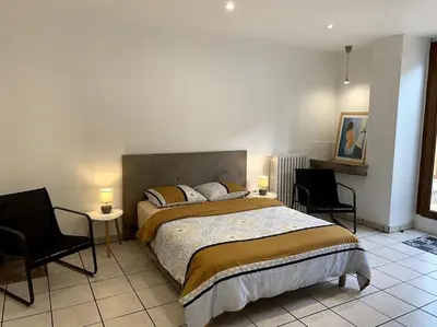 Un ou plusieurs lits dans un hébergement de l'établissement Appartement cosy Lons - Montmorot