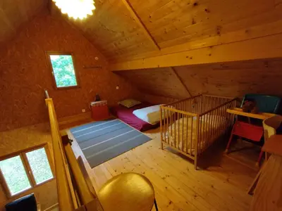 Un ou plusieurs lits dans un hébergement de l'établissement Gîte Chalet Morvan Bourgogne