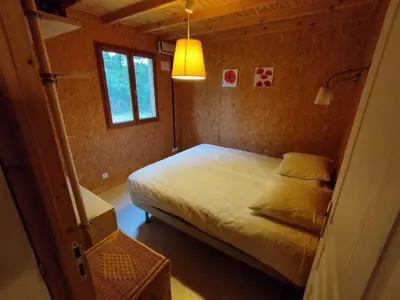 Un ou plusieurs lits dans un hébergement de l'établissement Gîte Chalet Morvan Bourgogne