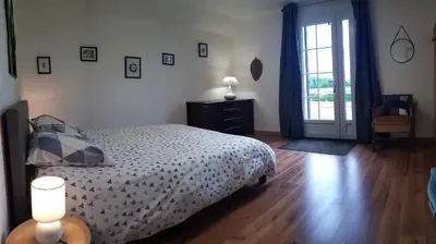 Un ou plusieurs lits dans un hébergement de l'établissement LE CLOS DES PRAIRIES Suite 2 grandes chambres