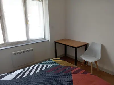 Un ou plusieurs lits dans un hébergement de l'établissement Appartement paisible - cœur de ville