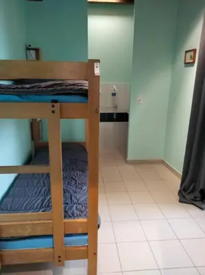 Un ou plusieurs lits dans un hébergement de l'établissement Gîte de la tour
