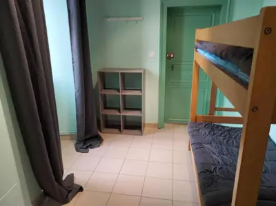 Un ou plusieurs lits dans un hébergement de l'établissement Gîte de la tour