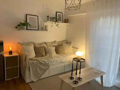 Un ou plusieurs lits dans un hébergement de l'établissement Studio Tivoli la Tour