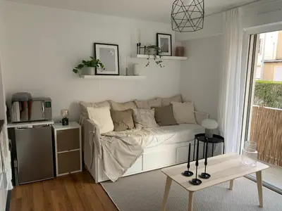 Un ou plusieurs lits dans un hébergement de l'établissement Studio Tivoli la Tour