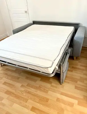 Un ou plusieurs lits dans un hébergement de l'établissement Agréable gîte au coeur du centre ville 4 personnes
