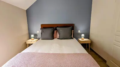 Un ou plusieurs lits dans un hébergement de l'établissement Le Clos des écureuils - chambres d'hôtes
