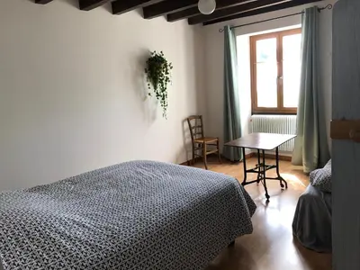 Un ou plusieurs lits dans un hébergement de l'établissement Gîte du champ de la Briette