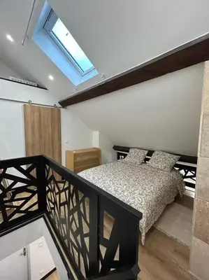 Un ou plusieurs lits dans un hébergement de l'établissement Le Darcy, grand appartement centre ville Dijon, proche gare