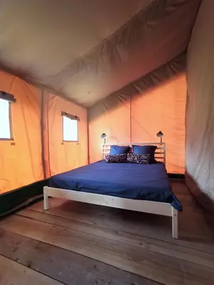 Un ou plusieurs lits dans un hébergement de l'établissement Le Lodge de la Chouette