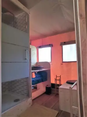 Un ou plusieurs lits dans un hébergement de l'établissement Le Lodge de la Chouette