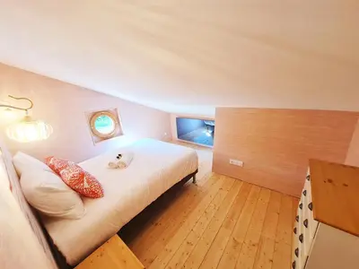 Un ou plusieurs lits dans un hébergement de l'établissement Cabanes du Domaine des Fées