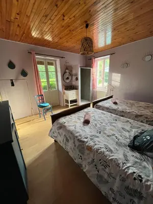 Un ou plusieurs lits dans un hébergement de l'établissement La maison de Command