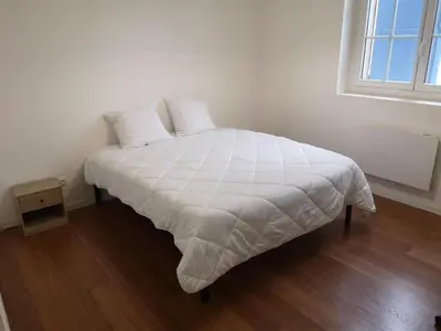 Un ou plusieurs lits dans un hébergement de l'établissement Le Cosy de Paray 4 couchages