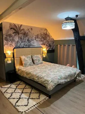 Un ou plusieurs lits dans un hébergement de l'établissement Les clos de Givry - Clos Théodore - Appartement 88m2 climatisé avec sauna et petite terrasse