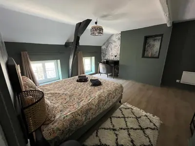 Un ou plusieurs lits dans un hébergement de l'établissement Les clos de Givry - Clos Théodore - Appartement 88m2 climatisé avec sauna et petite terrasse