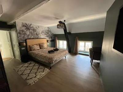 Un ou plusieurs lits dans un hébergement de l'établissement Les clos de Givry - Clos Théodore - Appartement 88m2 climatisé avec sauna et petite terrasse