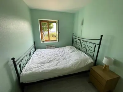 Un ou plusieurs lits dans un hébergement de l'établissement Cottage with Splendid Views