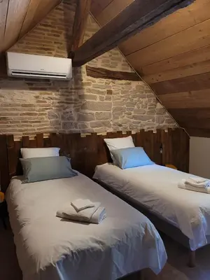 Un ou plusieurs lits dans un hébergement de l'établissement GÎTE LE GEVOT