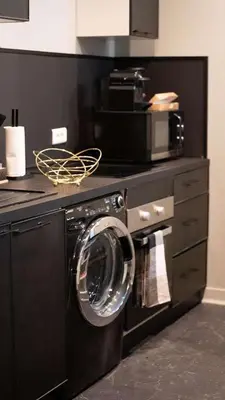 Cuisine ou kitchenette dans l'établissement Escapade Urbaine - Balnéothérapie - Cinéma au Cœur de la Ville
