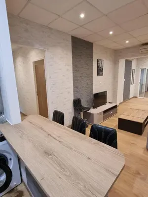 Coin salon dans l'établissement Appartement Centre ville