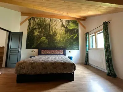 Un ou plusieurs lits dans un hébergement de l'établissement les anthocyanes CHAMBRE FORET