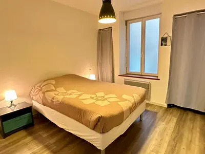 Un ou plusieurs lits dans un hébergement de l'établissement Appartement calme au cœur de la ville