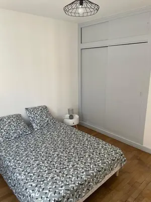 Un ou plusieurs lits dans un hébergement de l'établissement cosy et calme au cœur de la ville