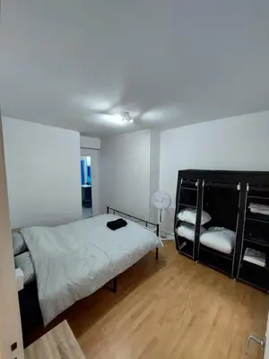 Un ou plusieurs lits dans un hébergement de l'établissement Appartement Le Suly