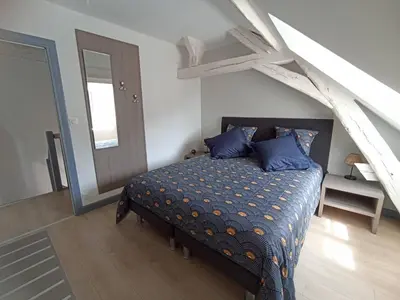 Un ou plusieurs lits dans un hébergement de l'établissement Le palais duplex