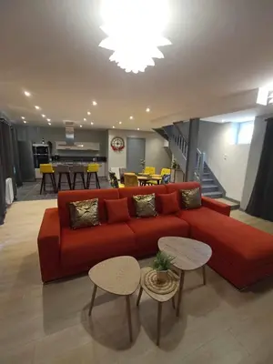 Coin salon dans l'établissement Le palais duplex