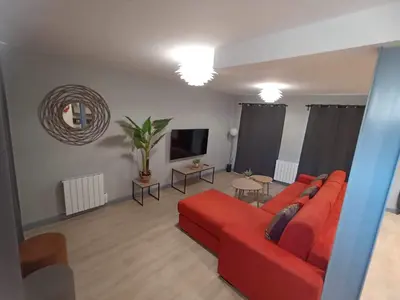Télévision ou salle de divertissement dans l'établissement Le palais duplex