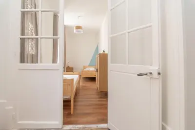 Un ou plusieurs lits dans un hébergement de l'établissement Magnifique logement spacieux hyper centre
