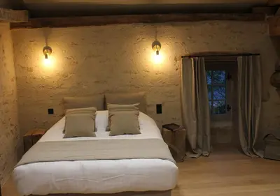 Un ou plusieurs lits dans un hébergement de l'établissement Châteauneuf Suites
