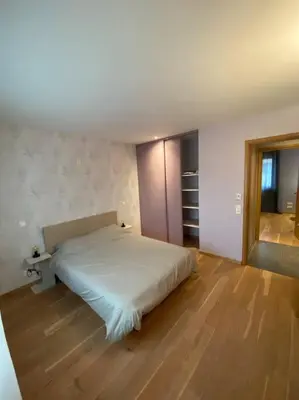 Un ou plusieurs lits dans un hébergement de l'établissement Maison ossature bois