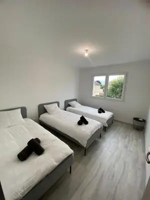 Un ou plusieurs lits dans un hébergement de l'établissement Maison moderne