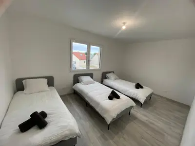 Un ou plusieurs lits dans un hébergement de l'établissement Maison moderne