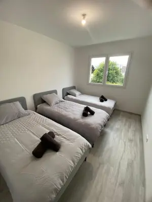 Un ou plusieurs lits dans un hébergement de l'établissement Maison moderne