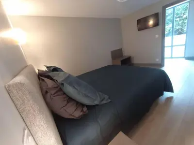 Un ou plusieurs lits dans un hébergement de l'établissement Appartement Le palais autun