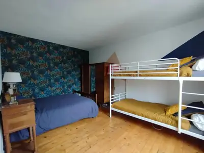 Un ou plusieurs lits dans un hébergement de l'établissement Maison centre-ville calme avec jardin