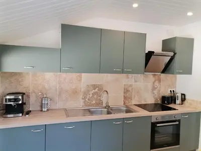 Cuisine ou kitchenette dans l'établissement L'Alcôve des Falaises