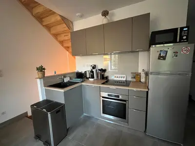 Cuisine ou kitchenette dans l'établissement Ô Happy Daix