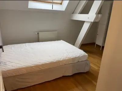 Un ou plusieurs lits dans un hébergement de l'établissement Appartement à Beaune avec Parking