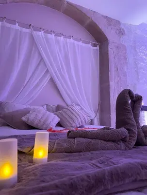 Un ou plusieurs lits dans un hébergement de l'établissement La voute Doloise - Love room & spa