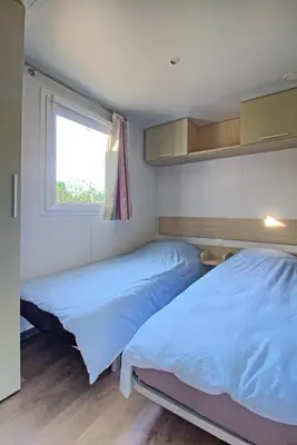 Un ou plusieurs lits dans un hébergement de l'établissement Mobilhome 3 chambres 6 personnes