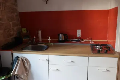 Cuisine ou kitchenette dans l'établissement Studio des mésanges