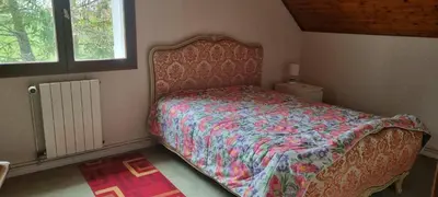 Un ou plusieurs lits dans un hébergement de l'établissement Location chambre dans villa